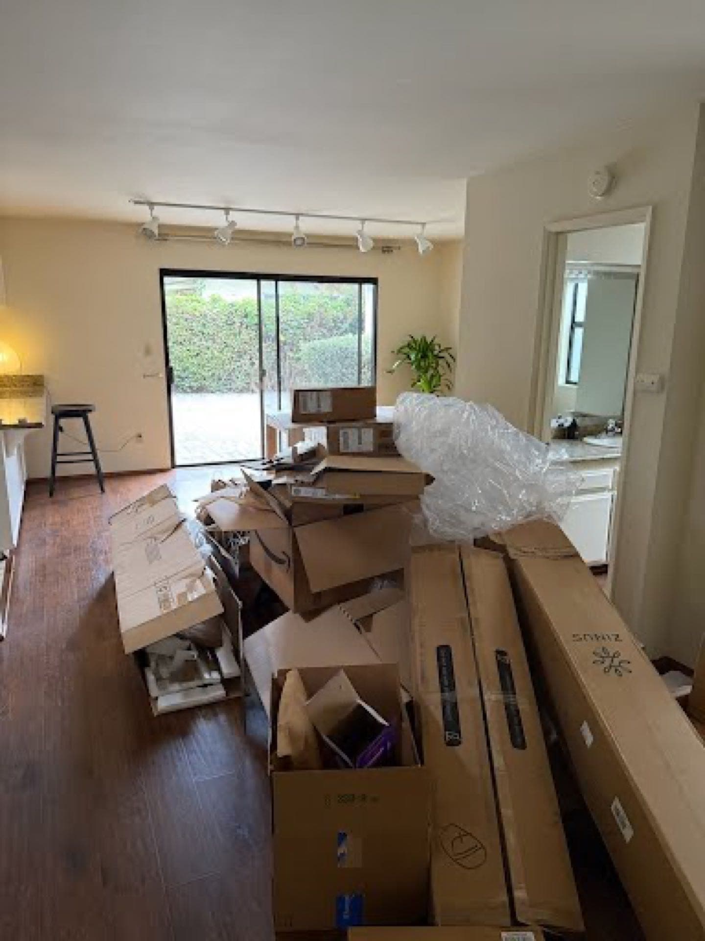 Foreclosure cleanout in a San Diego living room — JunkMD+ haul-away