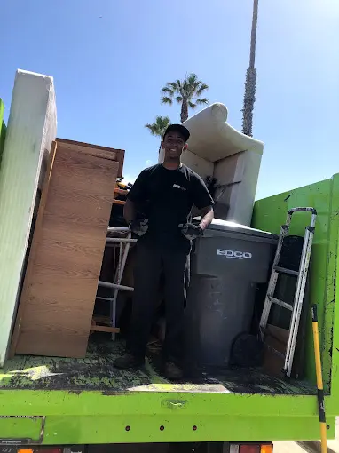 Old Furniture on a Dumpster Truck